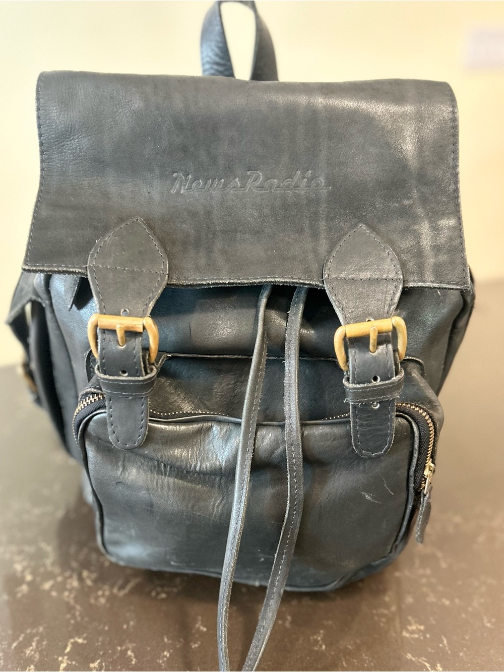 NewsRadio Embossed Vintage Leather Backpack